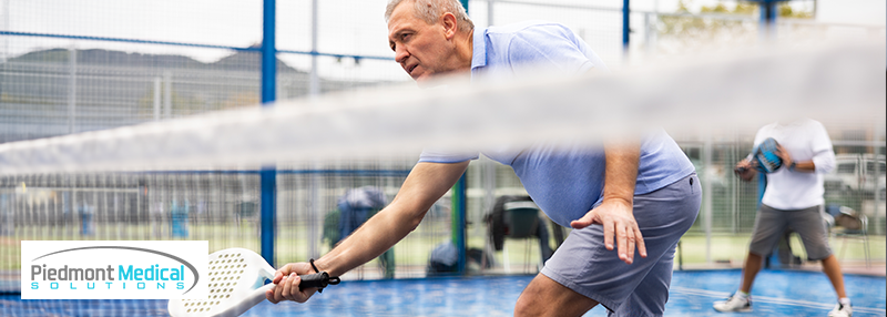 Man playing pickleball on the court