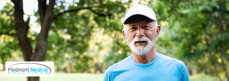 Older male wearing blue t-shirt