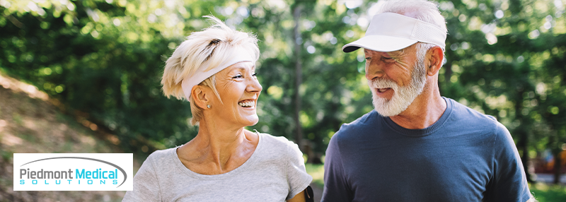 Happy elderly couple exercise walking