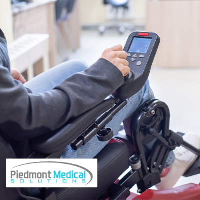 Power chair user controlling the joystick